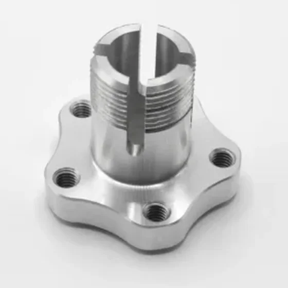 Flanged hub turned on a Spinner lathe: lobed flange, tapped holes, slotted thread