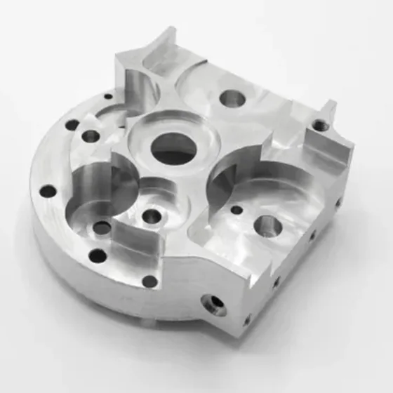 Housing plate milled on a Spinner machining center: pockets, bores and holes on several faces