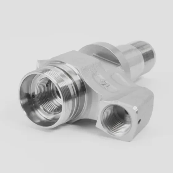 Valve body turned on a Spinner lathe: threaded ports and milled flats