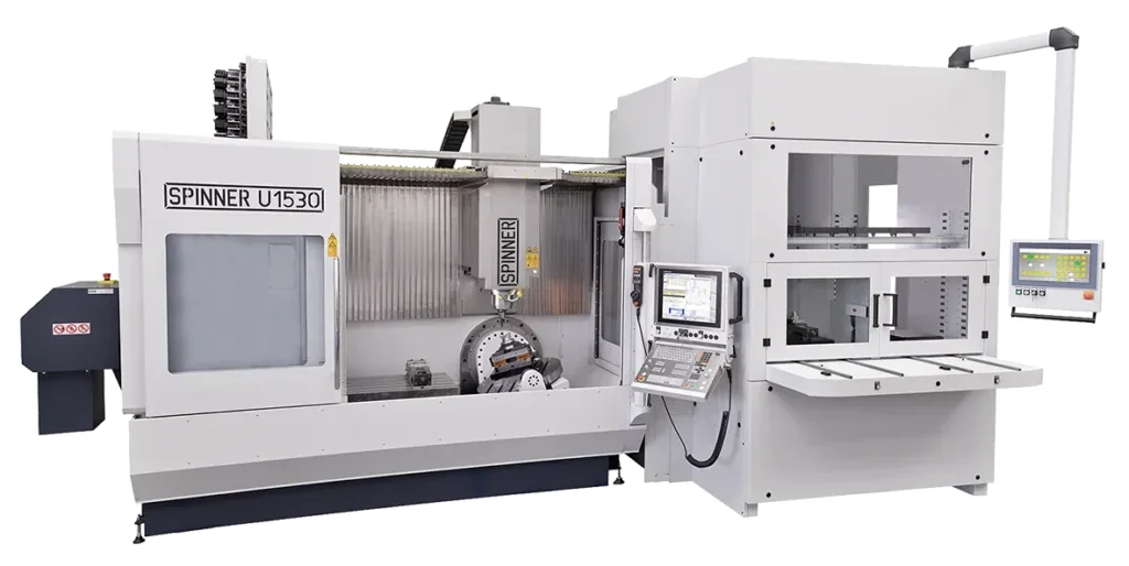 Spinner U5-1530 with an automation cell alongside: fixed table and rotary/tilting table in the work area, loading station on the right